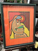 Framed limited edition print “Mother and Child” by Leland Bell with orange mat and black shadow frame with green accents, showing full artwork and frame.