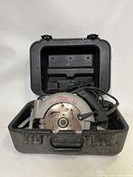 Porter Cable circular saw placed inside open carrying case showing front view with visible blade and handle.