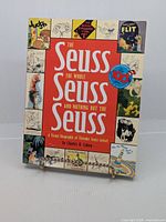 Front cover of The Seuss The Whole Seuss and Nothing but the Seuss book with various Seuss illustrations bordering the title.