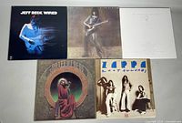 Five vinyl record albums: two Jeff Beck 'Wired', one Jethro Tull 'Aqualung', one Frank Zappa 'Zoot Allures', one Grateful Dead album cover.
