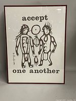 Full view of framed print with stylized figures and text 'accept one another'.