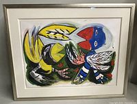 Front view of the framed painting showing full composition, white mat, and silver metal frame.