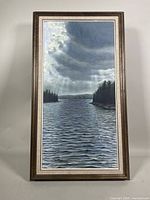 Full view of the framed acrylic painting on board depicting a water channel with cloudy sky and tree banks.