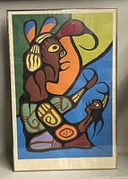 Full view of colorful framed silkscreen print, showing the entire image inside the frame with some reflections on glass.