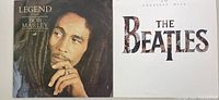 Front covers of Bob Marley 'Legend' and The Beatles '20 Greatest Hits' vinyl albums side by side.