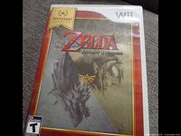 Front cover of game case showing The Legend of Zelda Twilight Princess artwork with Link and a wolf.