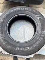 Americus tire showing sidewall branding and overall tire in good condition.