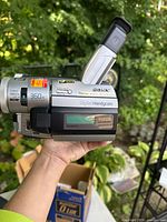 Side profile of camcorder with viewfinder extended showing 360x zoom and Digital8 branding