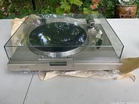 Top front view of Sony PS-11 stereo turntable system with closed dust cover.