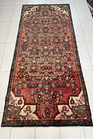 Full overhead view of the rug displaying the all-over floral and geometric design
