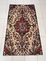 Full top-down view of the entire Hamadan Persian rug showing the beige background and central medallion design with floral motifs.