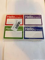 front view of sealed pack showing multicolor name tags