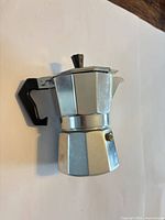 Full view of moka pot showing body, handle and spout