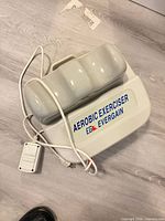 Full view of Evergain aerobic exerciser showing housing, platform, attached cord and controller