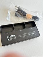 Godox VC26T charger with sealed power cord bag overview