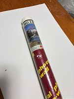 Rolled mural in red Jiann tube showing image and product number