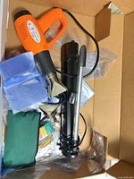 overview of kit showing heat gun, stand, bags, tubing and nozzles inside box