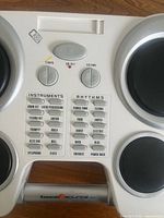 Close-up of control panel showing tempo, volume, instrument and rhythm buttons