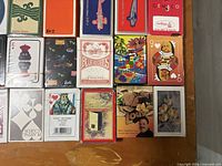 Assorted playing card decks showing various brands and designs