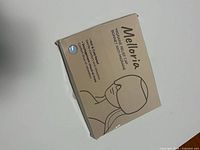 Front of Melloria migraine relief cap box with product illustration