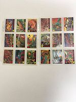 Full front view of all 18 trading cards in protective sleeves, showing artwork and border details.