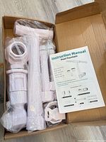 Box opened showing sealed fountain components and manual