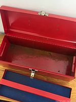 Toolbox open showing interior and removed tray, rust visible