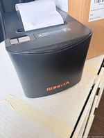 Front and top view of Rongta thermal receipt printer with paper roll