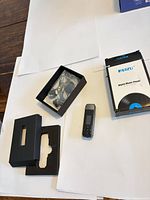 Player, box pieces and accessory bag laid out