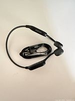 Headphones coiled with charging cable