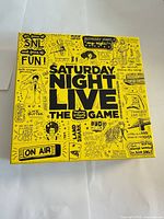 Front of yellow Saturday Night Live: The Game box