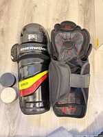 Front and interior view of shin guard with two pucks