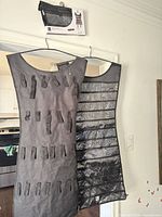 Both sides of the Umbra organizer hanging on door, small retail box visible