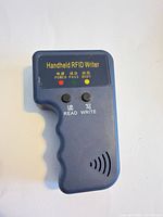 Front view showing buttons and LED indicators of handheld RFID writer
