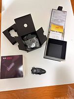 All components laid out: intercom, open box, accessories still bagged