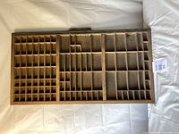 Top view showing multiple compartments of different sizes for organizing printer's letters or type.