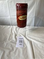 Photo shows unopened cylindrical container with Tim Hortons and Yahtzee branding