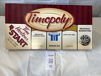 Box lid with Timopoly logo and Tim Hortons branding, showing the unopened game box.