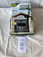 Packaged garage door screen showing brand, usage and closure system details.