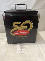 Front view of the cooler showing the large '50 Tim Hortons Since 1964' logo on the black steel body.