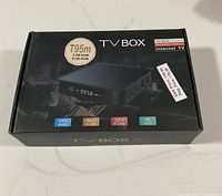 Box front showing T95m IPTV Box with 2GB RAM, 8GB ROM, 4K UHD, 64-bit CPU, H.265 codec