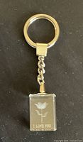Key ring pendant showing a 3D engraved rose with the text 'I LOVE YOU'.