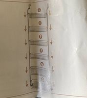 Diagram showing the frame with slots where baskets would hang, labeled parts for assembly.
