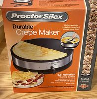 Box front showing Proctor Silex Durable Crepe Maker with 13-inch nonstick surface and batter spreader included.