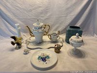 Full collection displayed on white cloth background showing all items in the lot