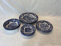 All items grouped together showing the variety and quantity of plates, bowls, and saucers from the Dickens Series.