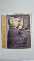 Front cover of the Henry Moore art book with a ruler for scale showing the book size.