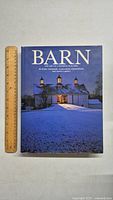 Front cover of the book showing the title, authors, and a night-time barn image