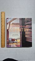 Front cover of the Contemporary Country book with interior design photo and title.