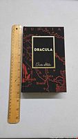 Front cover of the Dracula special edition hardcover showing the fabric cover with a map design and Bram Stoker's signature.